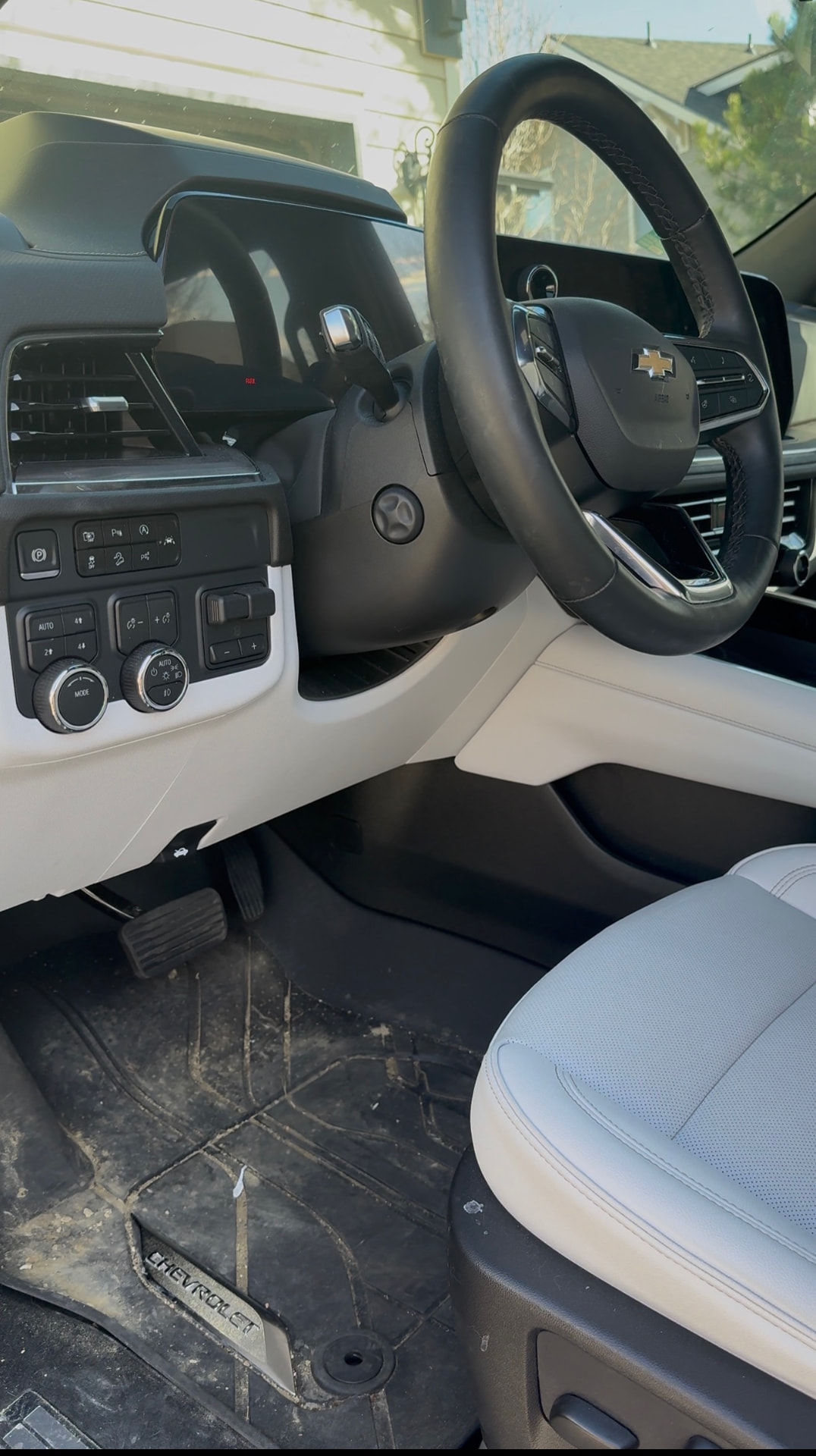 Dusty SUV cabin with dirty floor mats and grimy dashboard before detailing